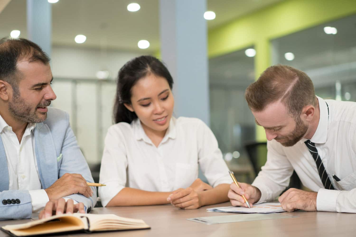 An attorney reviews a DIY Will with clients.