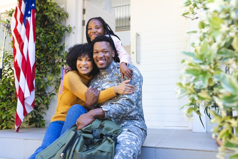 Retired military couple reviewing estate planning documents at home in Hampton Roads Virginia